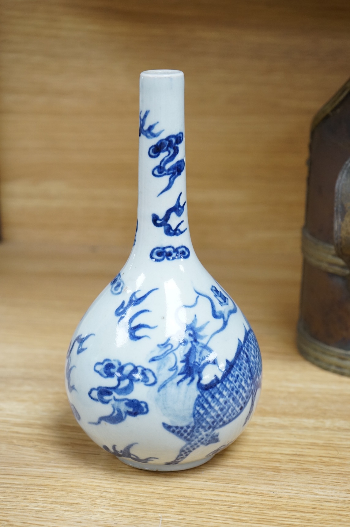 A Chinese blue and white bottle vase, a crackle glaze vase and a Tibetan copper and brass ‘monk’ cap’ ewer (3), tallest 21cm